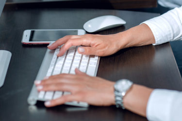 Close up customer service specialists work in the office