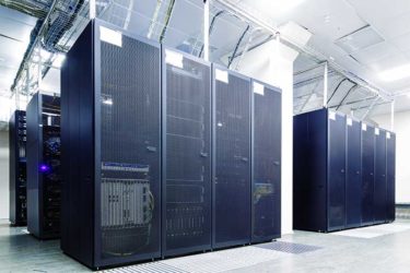 Room with rows of server hardware in the data center