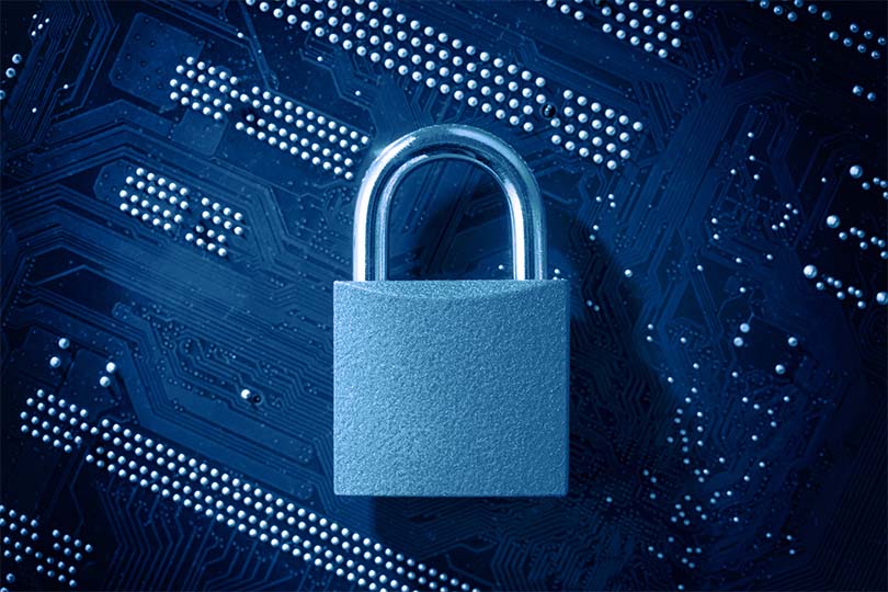 closed padlock on digital circuit board representing data security