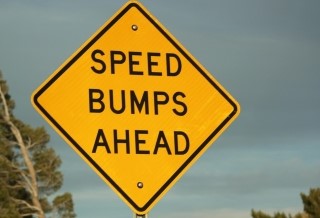 Traffic sign: speed bumps ahead.
