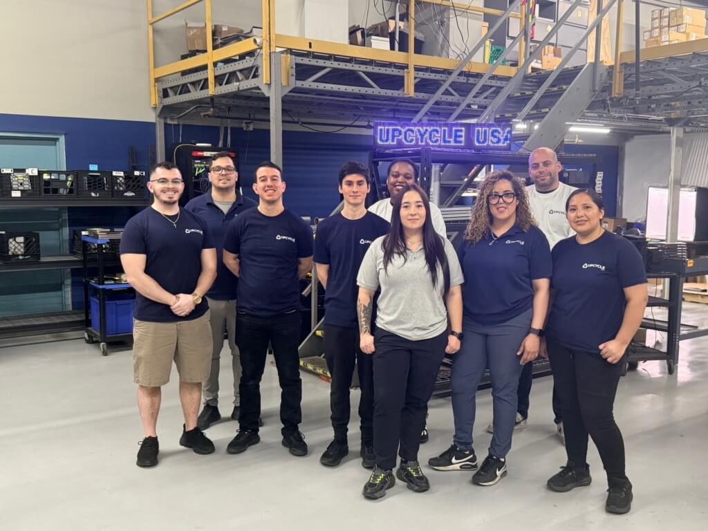 Upcycle team members in their processing facility, supporting scalable ITAD operations